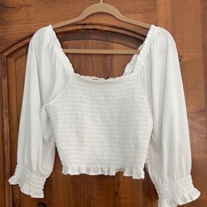 Ivory colored off or on the shoulder blouse